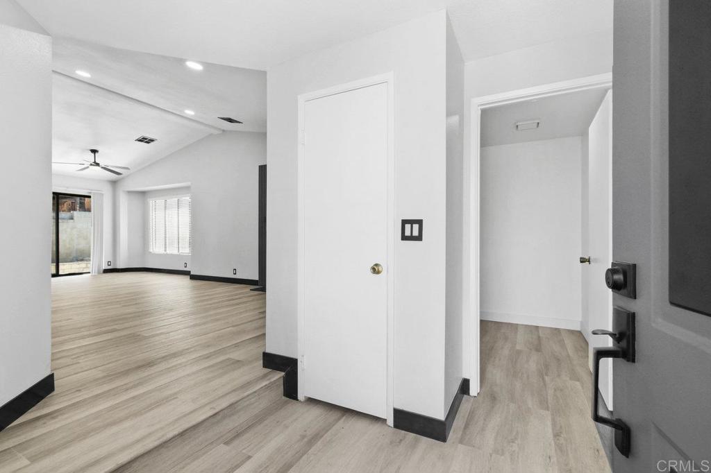 8409 Sleepy Way El Cajon, CA 92021 - Photo 5 of 31 a view of a livingroom with wooden floor