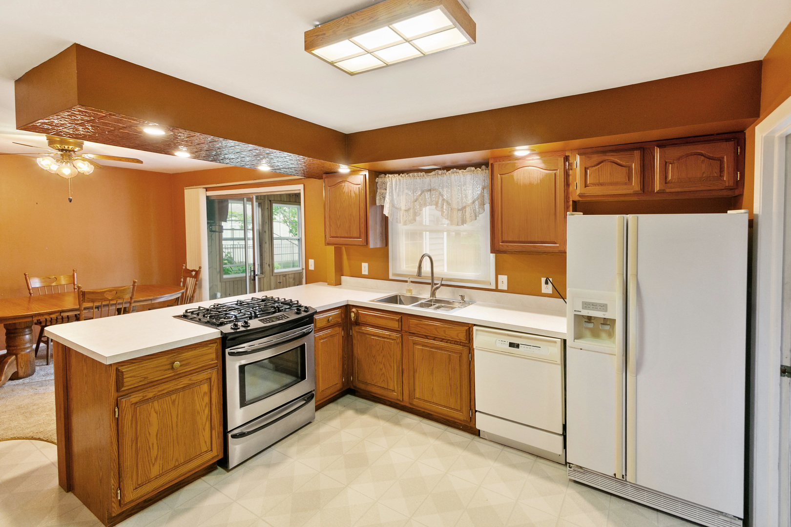 314 Boulder Hill Pass Montgomery, IL 60538 - Photo 9 of 19 a kitchen with stainless steel appliances granite countertop a stove and a sink