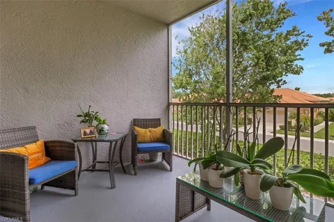 a view of a balcony with chairs