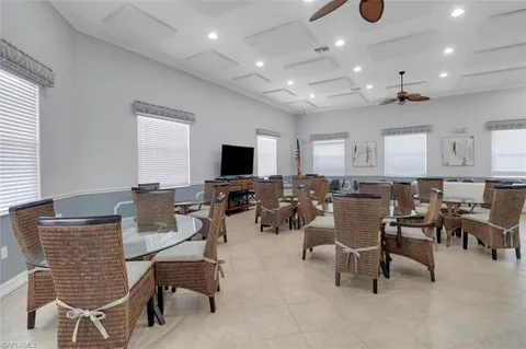 a view of a swimming pool with outdoor seating