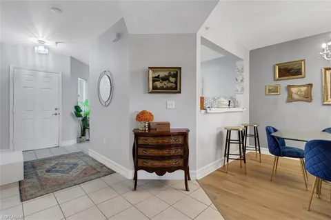 a view of a livingroom with furniture and a potted plant