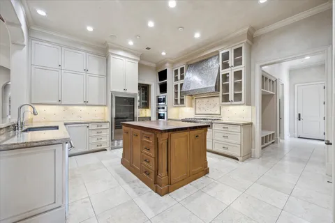 a kitchen with stainless steel appliances granite countertop a stove and a sink