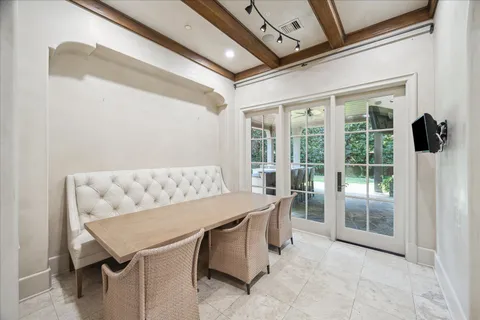 a view of a patio with a table and chairs