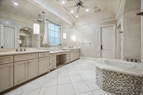 a spacious bathroom with a double vanity sink mirror and