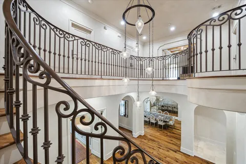 a large room with furniture and flat screen tv