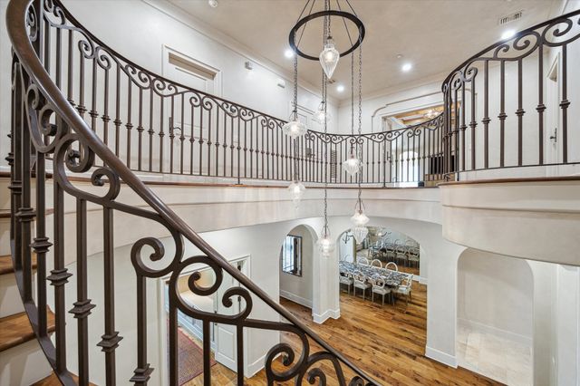 a large room with furniture and flat screen tv