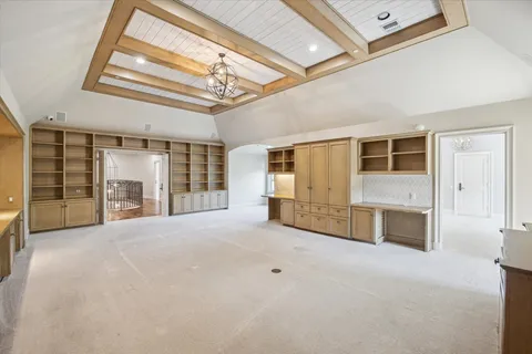 a view of a chandelier in a room with a window