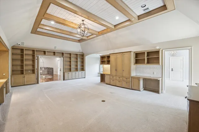 a view of a chandelier in a room with a window