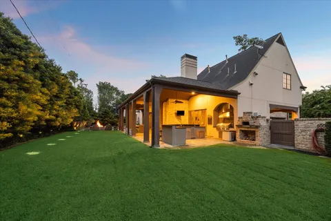 a view of a house with swimming pool yard and sitting area
