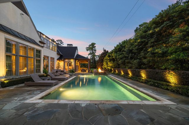 a view of swimming pool with outdoor seating