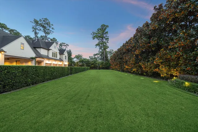 an aerial view of a house with a garden