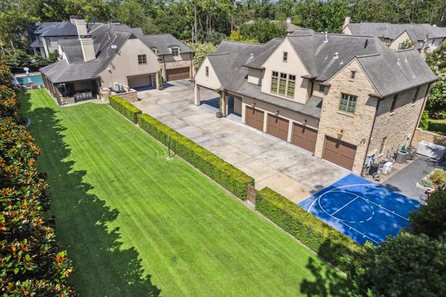 a view of a house with a yard and garage