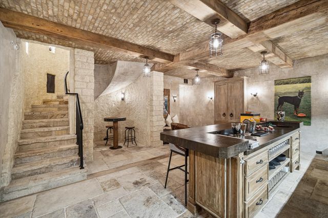 a kitchen with stainless steel appliances granite countertop a sink and cabinets