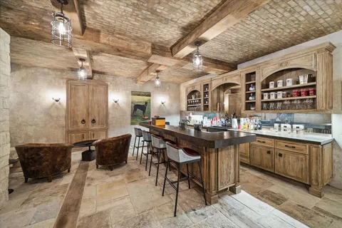 a bathroom with a stove a sink and a toilet