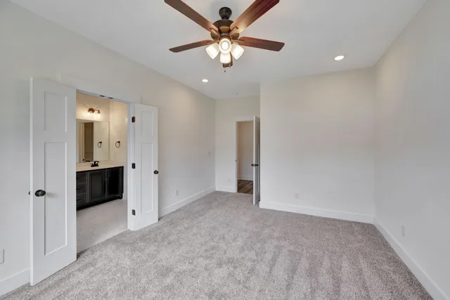a bathroom with a glass shower door