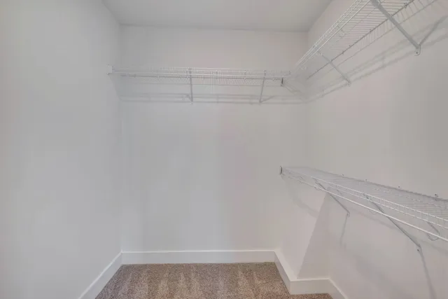 a view of a hallway with staircase