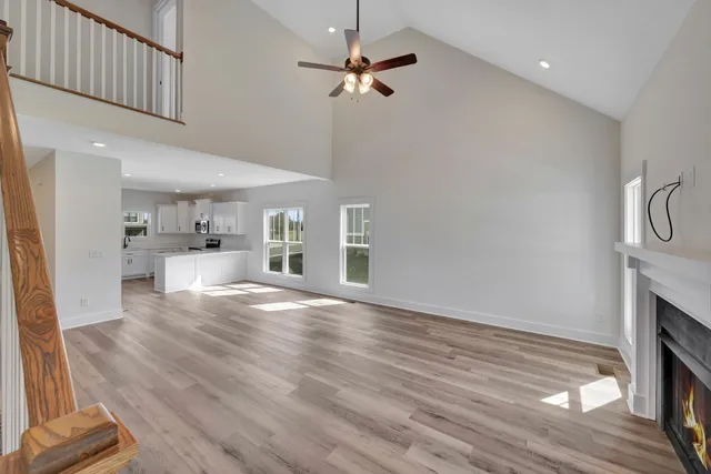 a view of a hallway view with wooden floor and staircase
