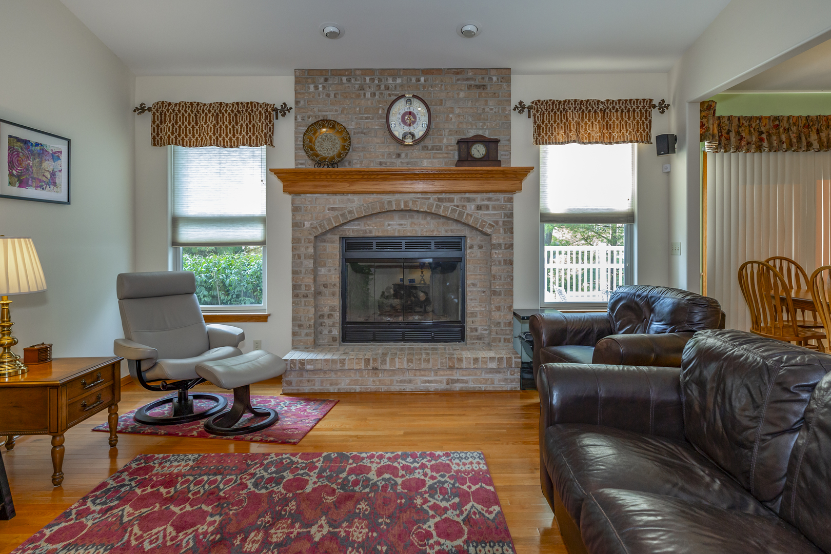311 Stearn Drive Genoa, IL 60135 - Photo 13 of 48 a living room with furniture and a fireplace