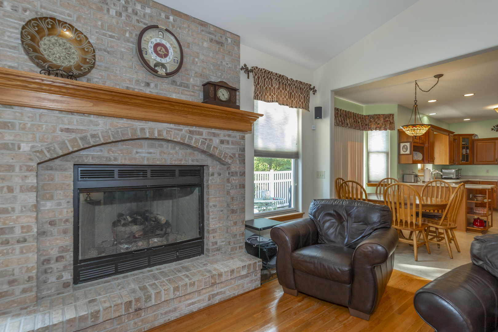 311 Stearn Drive Genoa, IL 60135 - Photo 14 of 48 a living room with furniture and a fireplace