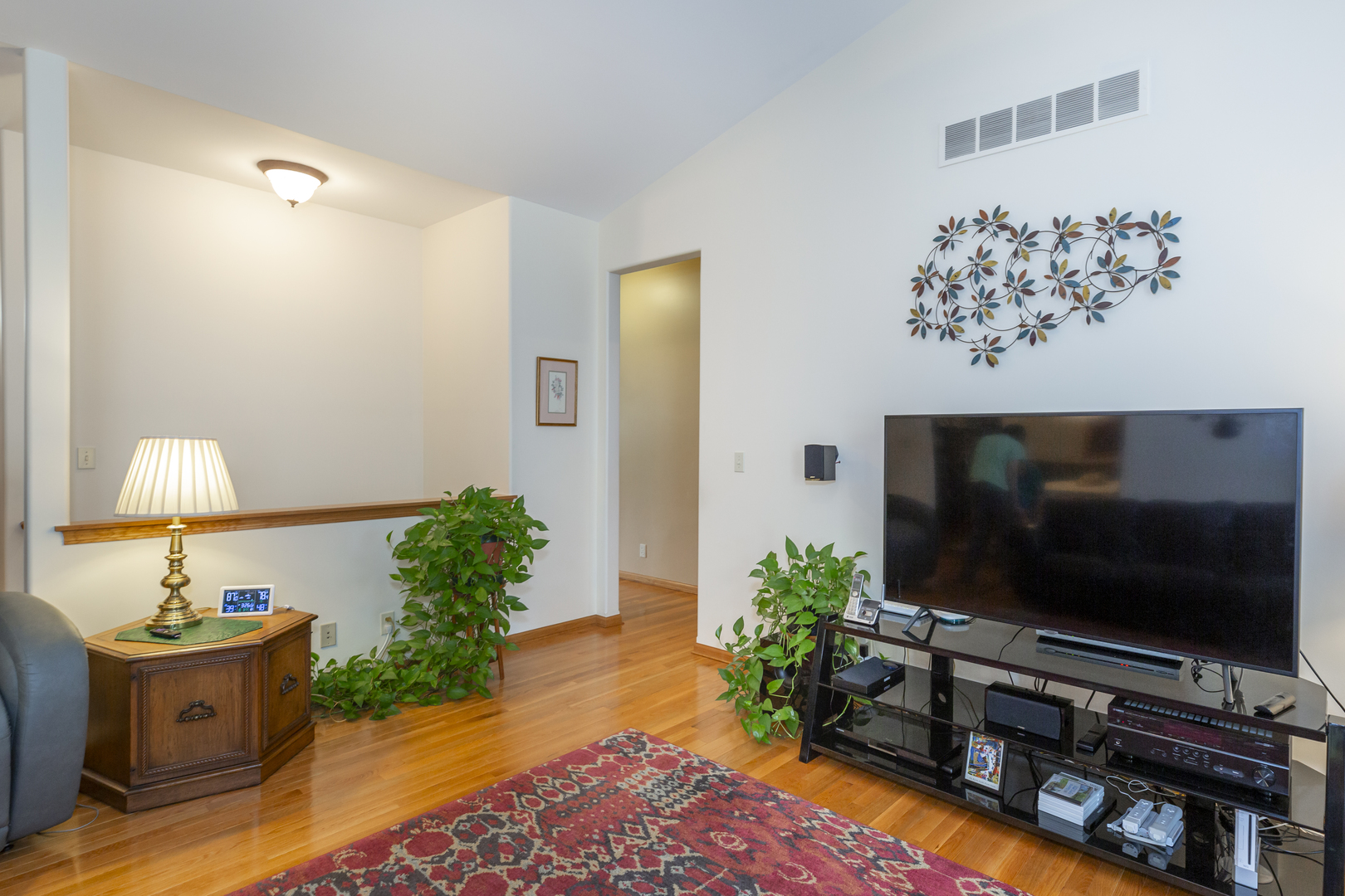 311 Stearn Drive Genoa, IL 60135 - Photo 15 of 48 a living room with furniture and a flat screen tv