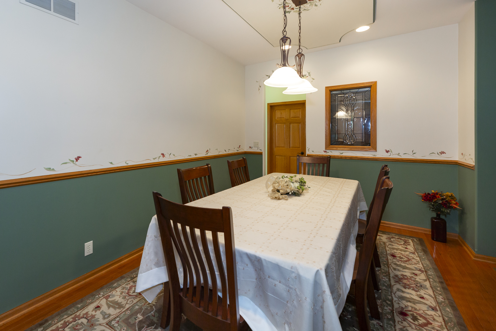 311 Stearn Drive Genoa, IL 60135 - Photo 24 of 48 a view of a dining room with furniture and wooden floor