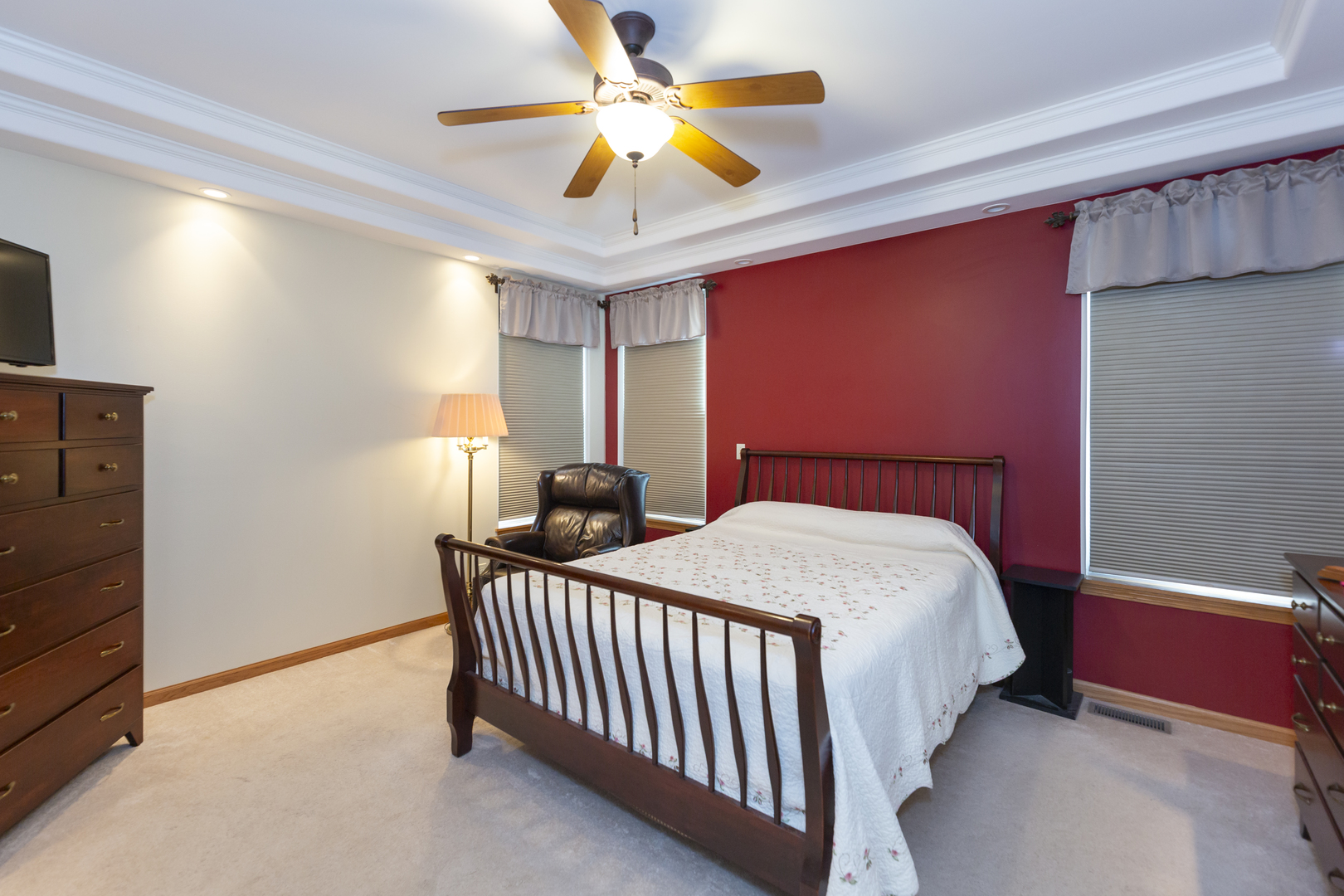 311 Stearn Drive Genoa, IL 60135 - Photo 26 of 48 a bedroom with a bed and a ceiling fan