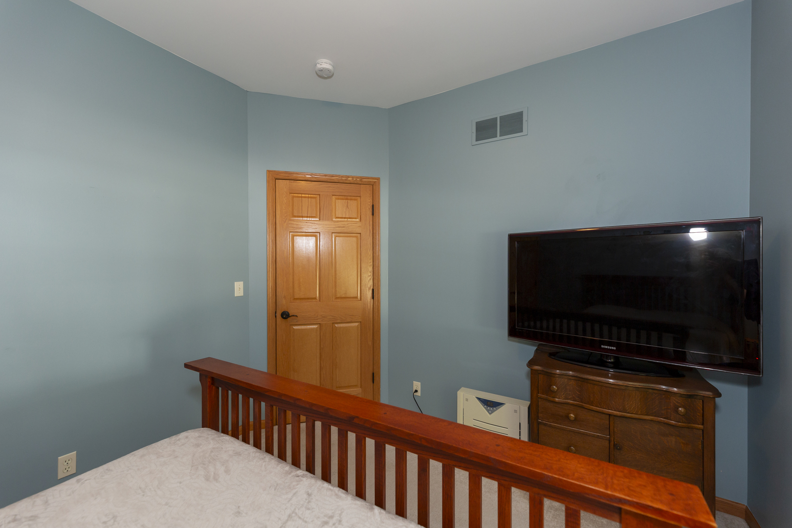 311 Stearn Drive Genoa, IL 60135 - Photo 29 of 48 a room with furniture and flat screen tv