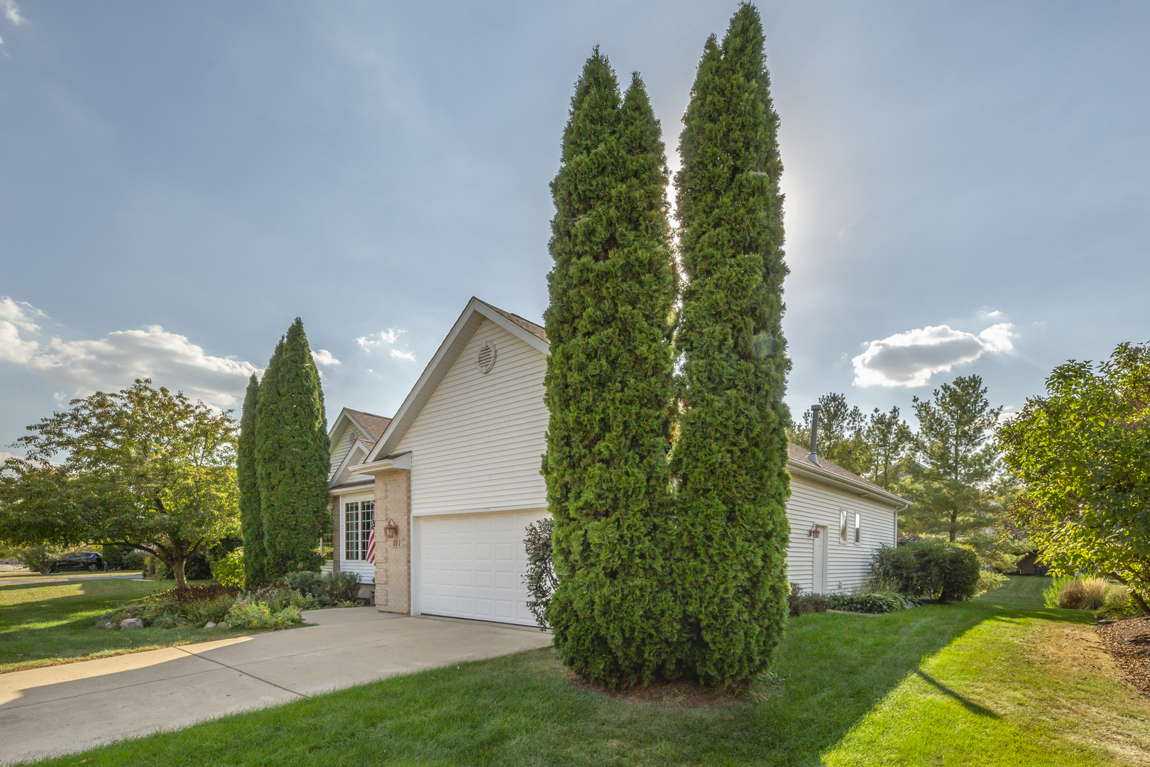 311 Stearn Drive Genoa, IL 60135 - Photo 3 of 48 a view of a yard in front of a house