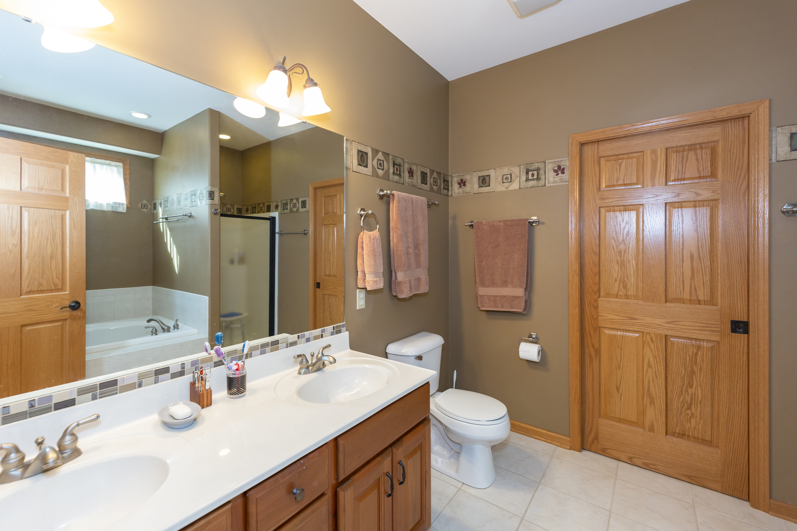311 Stearn Drive Genoa, IL 60135 - Photo 35 of 48 a bathroom with a sink vanity granite toilet tub and shower