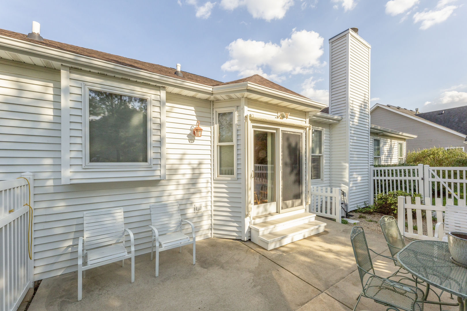 311 Stearn Drive Genoa, IL 60135 - Photo 37 of 48 a view of a chair with a door and wooden floor
