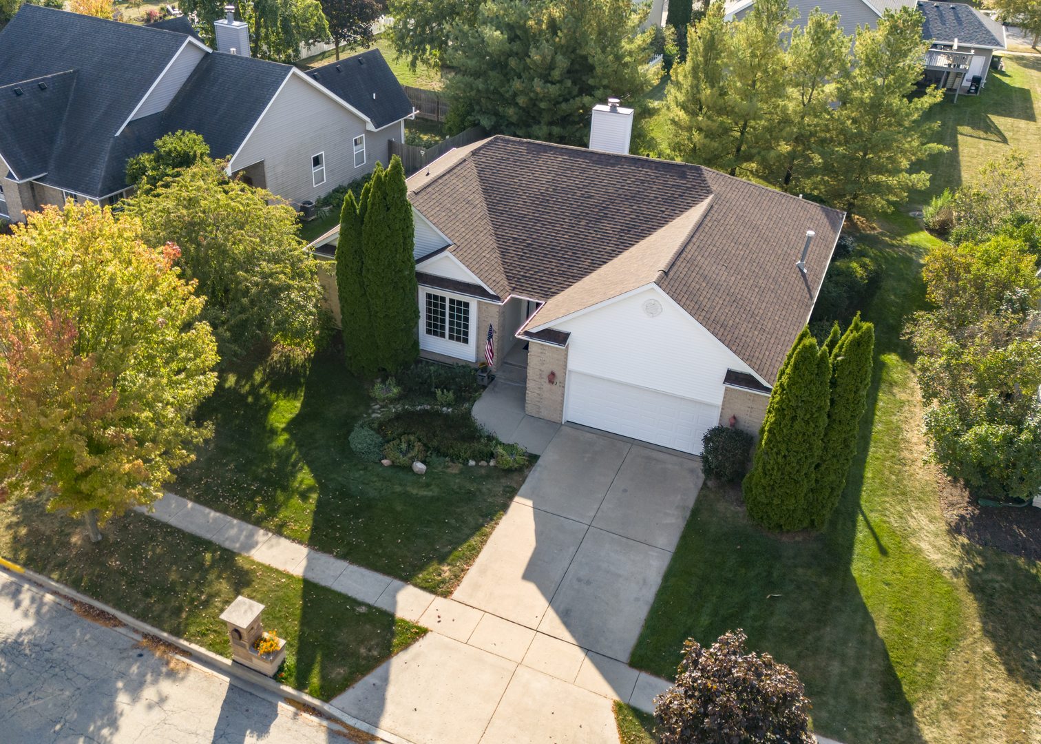 311 Stearn Drive Genoa, IL 60135 - Photo 4 of 48 a aerial view of a house with a yard and potted plants