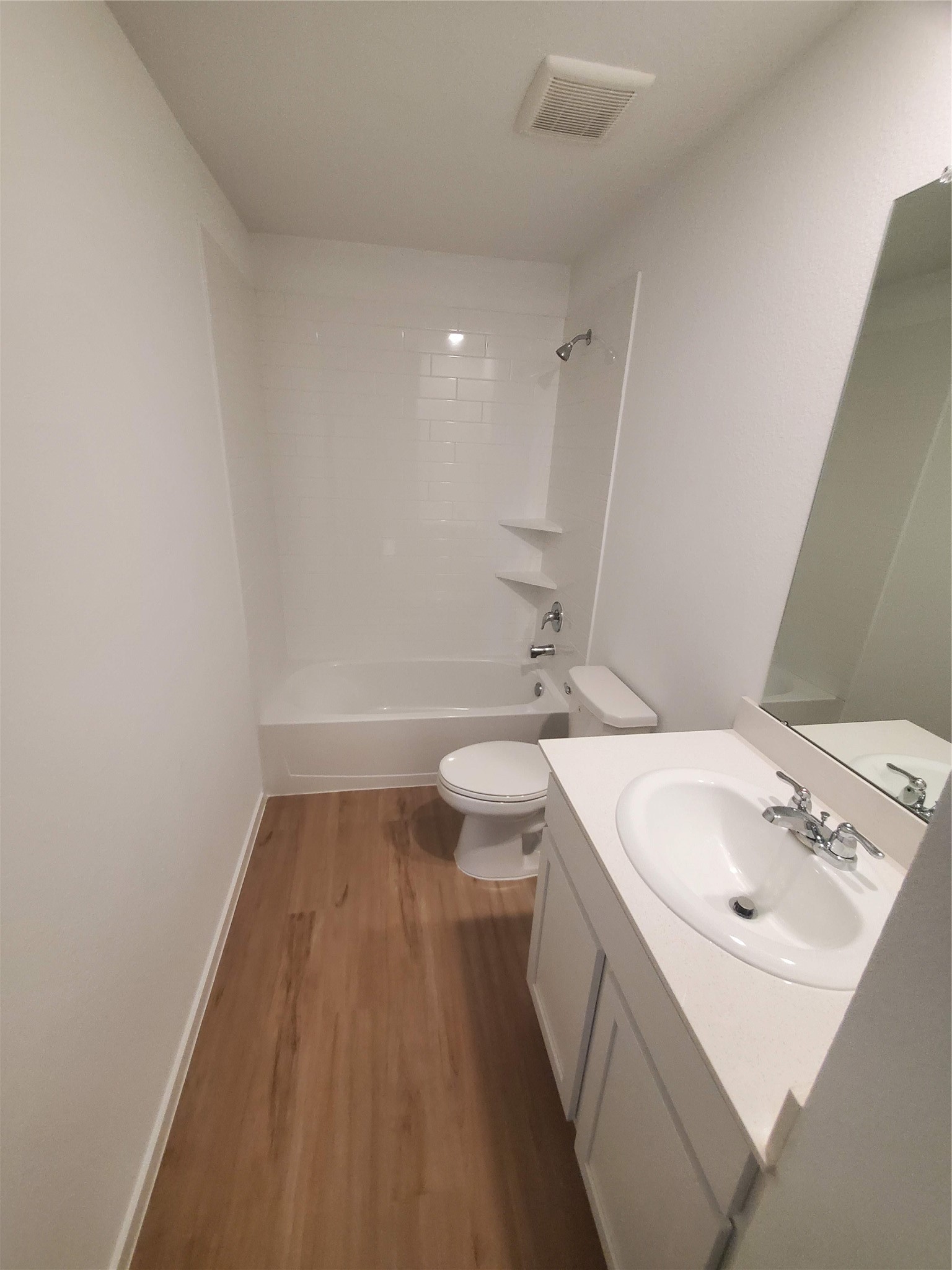 3115 Savannah Rose Drive Angleton, TX 77515 - Photo 11 of 20 a bathroom with a sink a toilet and a mirror
