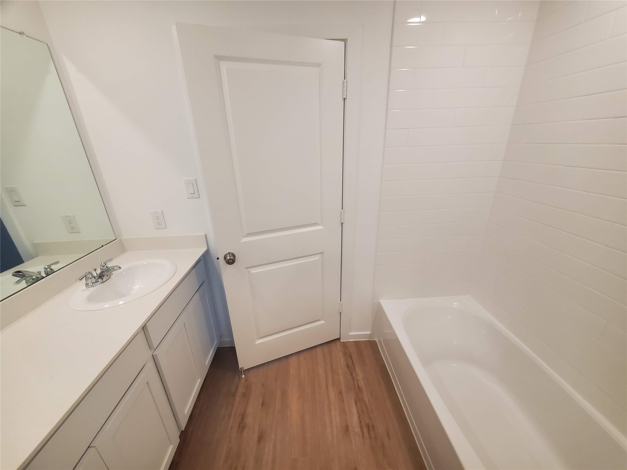 3115 Savannah Rose Drive Angleton, TX 77515 - Photo 8 of 20 a bathroom with a tub sink and mirror