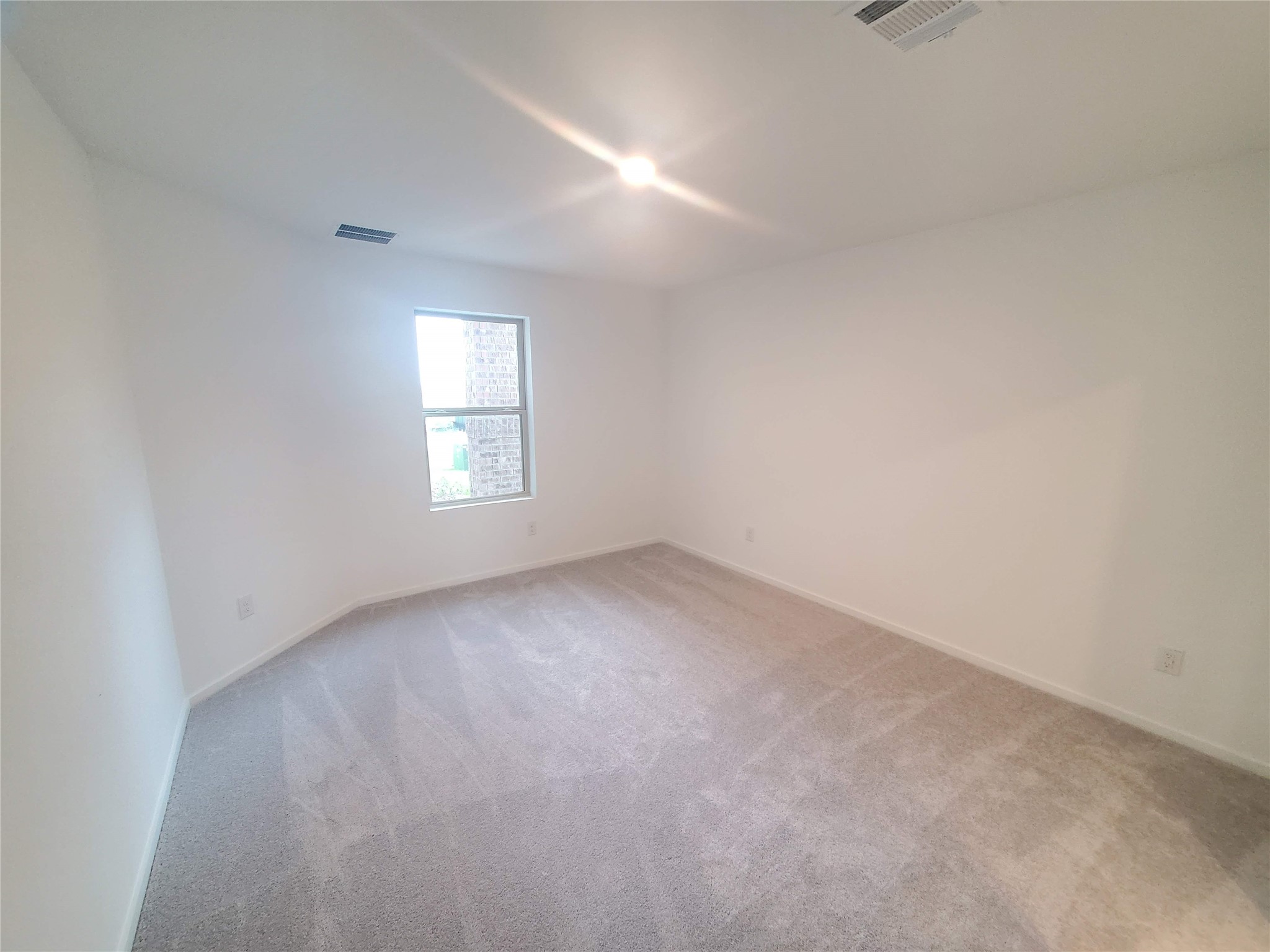 3115 Savannah Rose Drive Angleton, TX 77515 - Photo 10 of 20 an empty room with a window and windows