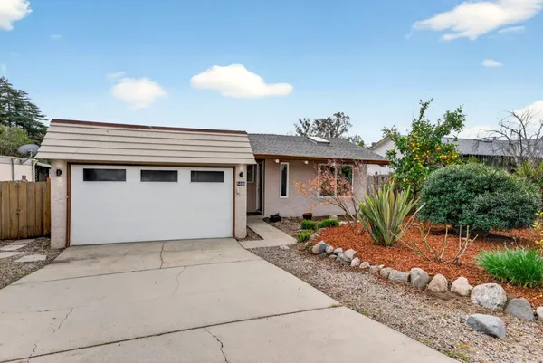 a front view of a house with a garage