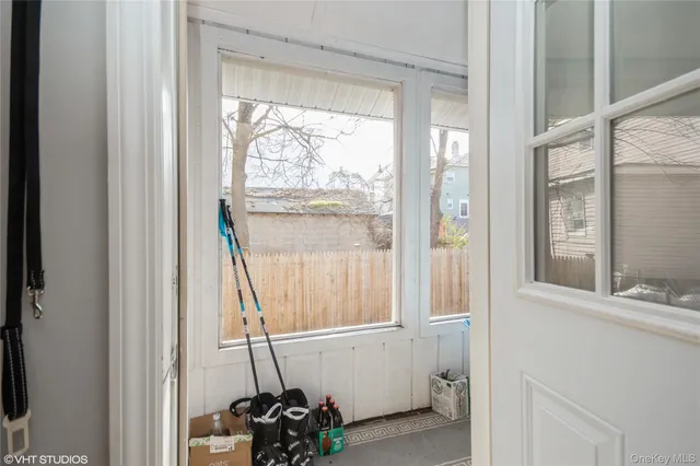 a view of an entryway with wooden floor