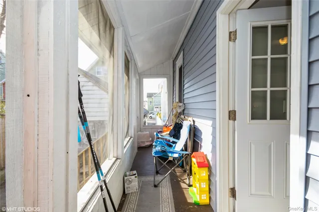 a view of a house with a yard and pathway