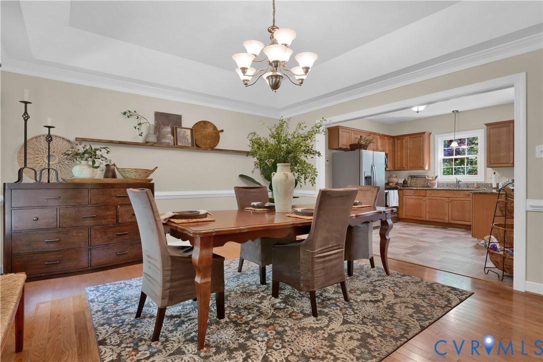 16148 Buckfast Place Beaverdam, VA 23015 - Photo 12 of 48 a view of a dining room with furniture and chandelier