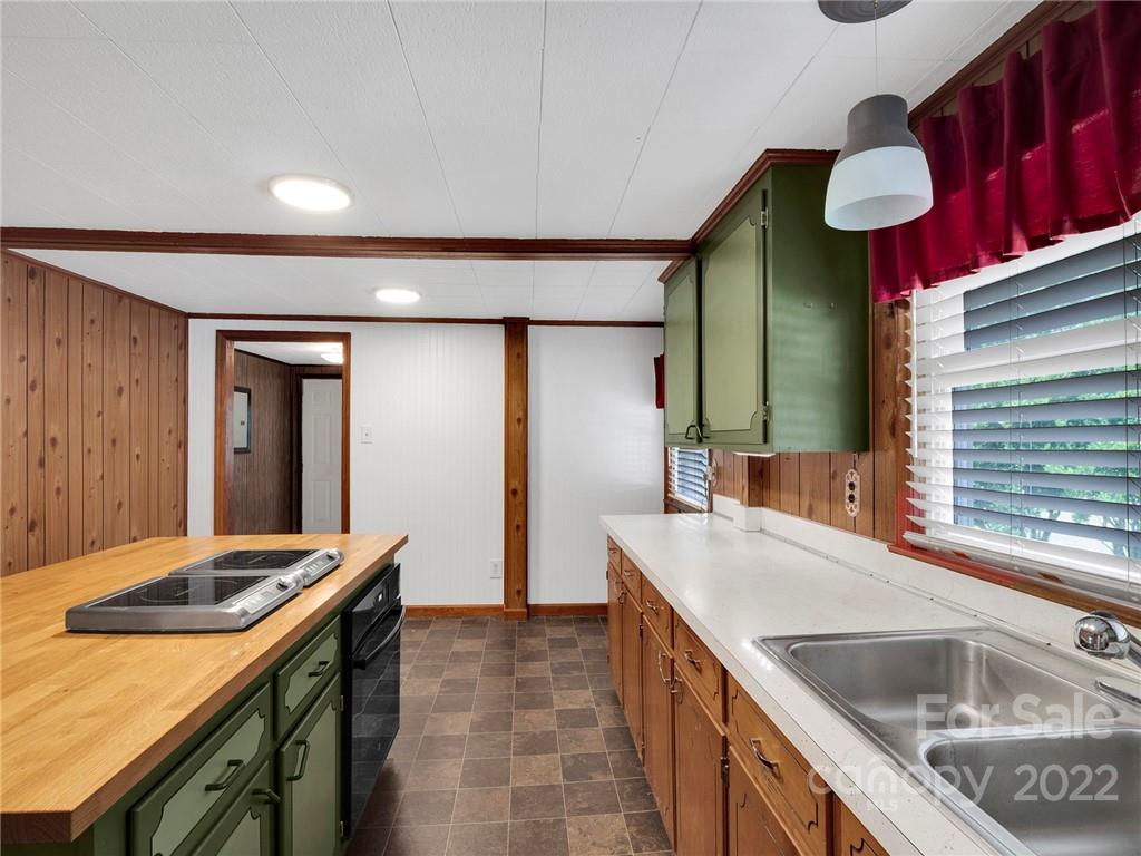 5614 Griffith Road Monroe, NC 28112 - Photo 15 of 28 a kitchen with a sink and a refrigerator