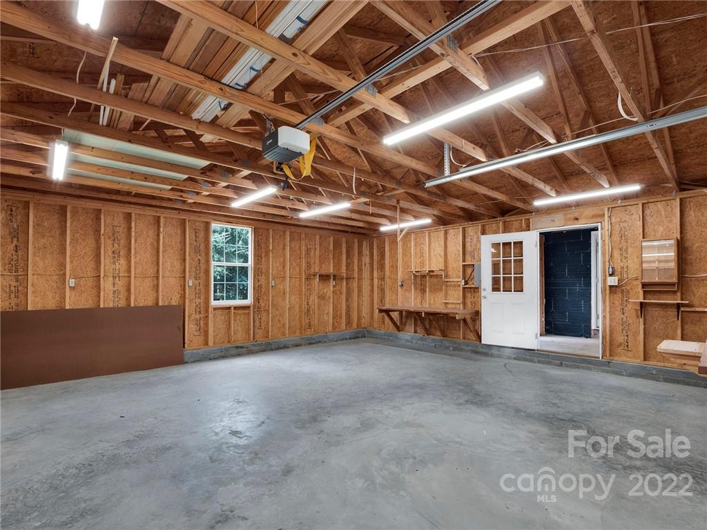 5614 Griffith Road Monroe, NC 28112 - Photo 25 of 28 a view of an empty room with a roof