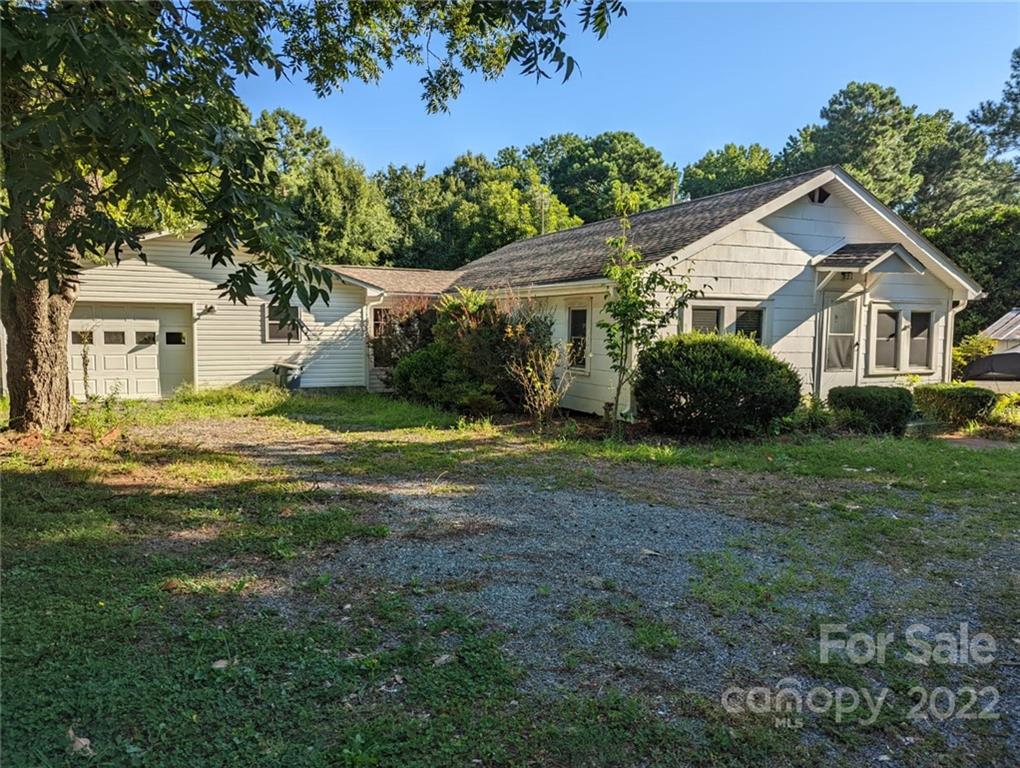 5614 Griffith Road Monroe, NC 28112 - Photo 28 of 28 a view of a house with a big yard and large trees