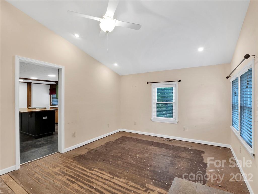 5614 Griffith Road Monroe, NC 28112 - Photo 9 of 28 wooden floor in an empty room with a window