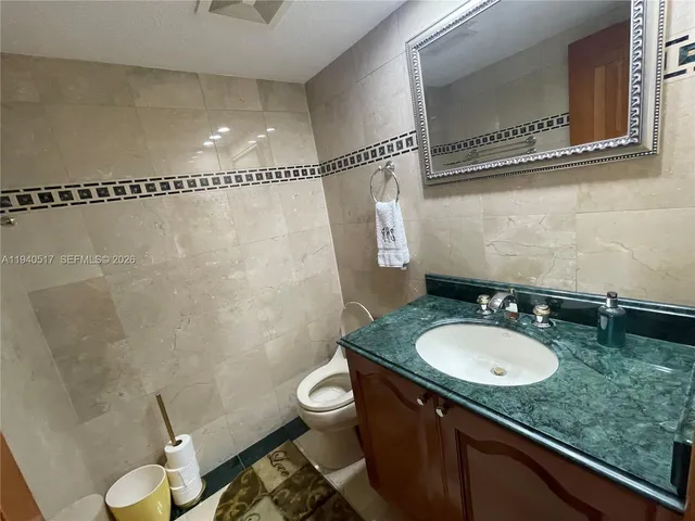 a bedroom with a bed and a television in it