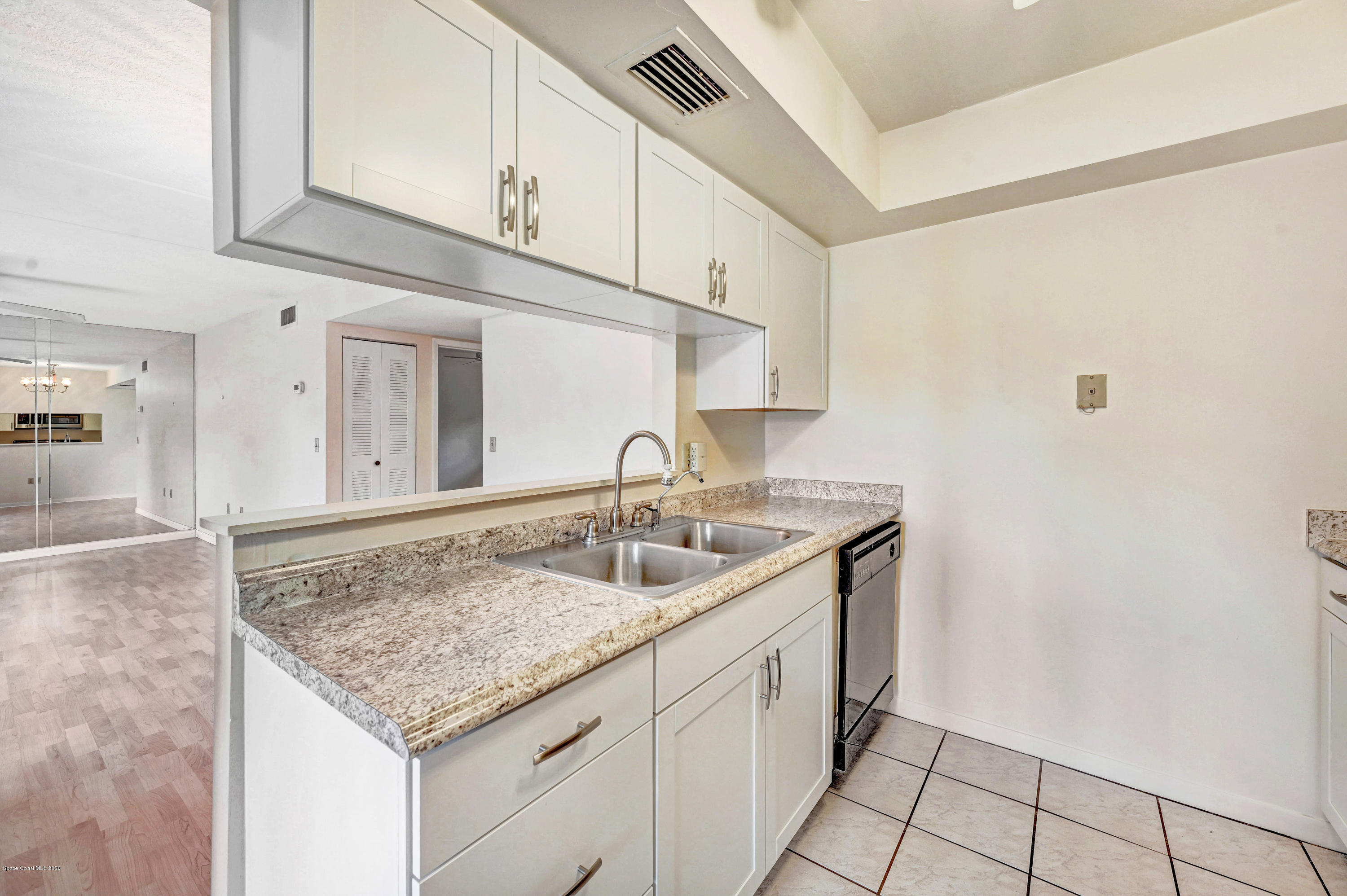 708 Ridge Club Drive, Unit 37 Melbourne, FL 32934 - Photo 11 of 25 a kitchen with sink and cabinets