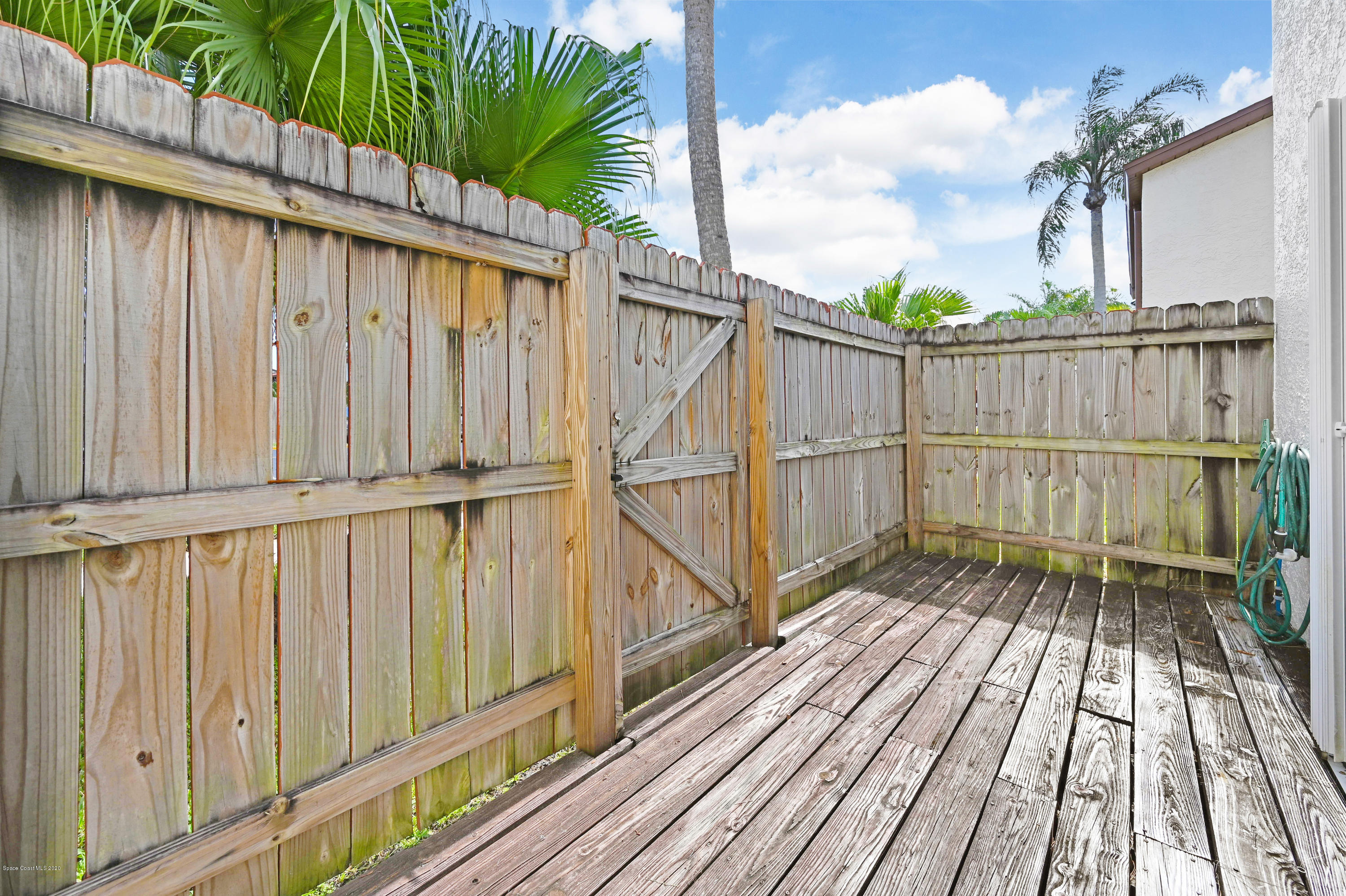 708 Ridge Club Drive, Unit 37 Melbourne, FL 32934 - Photo 16 of 25 a balcony with wooden floor