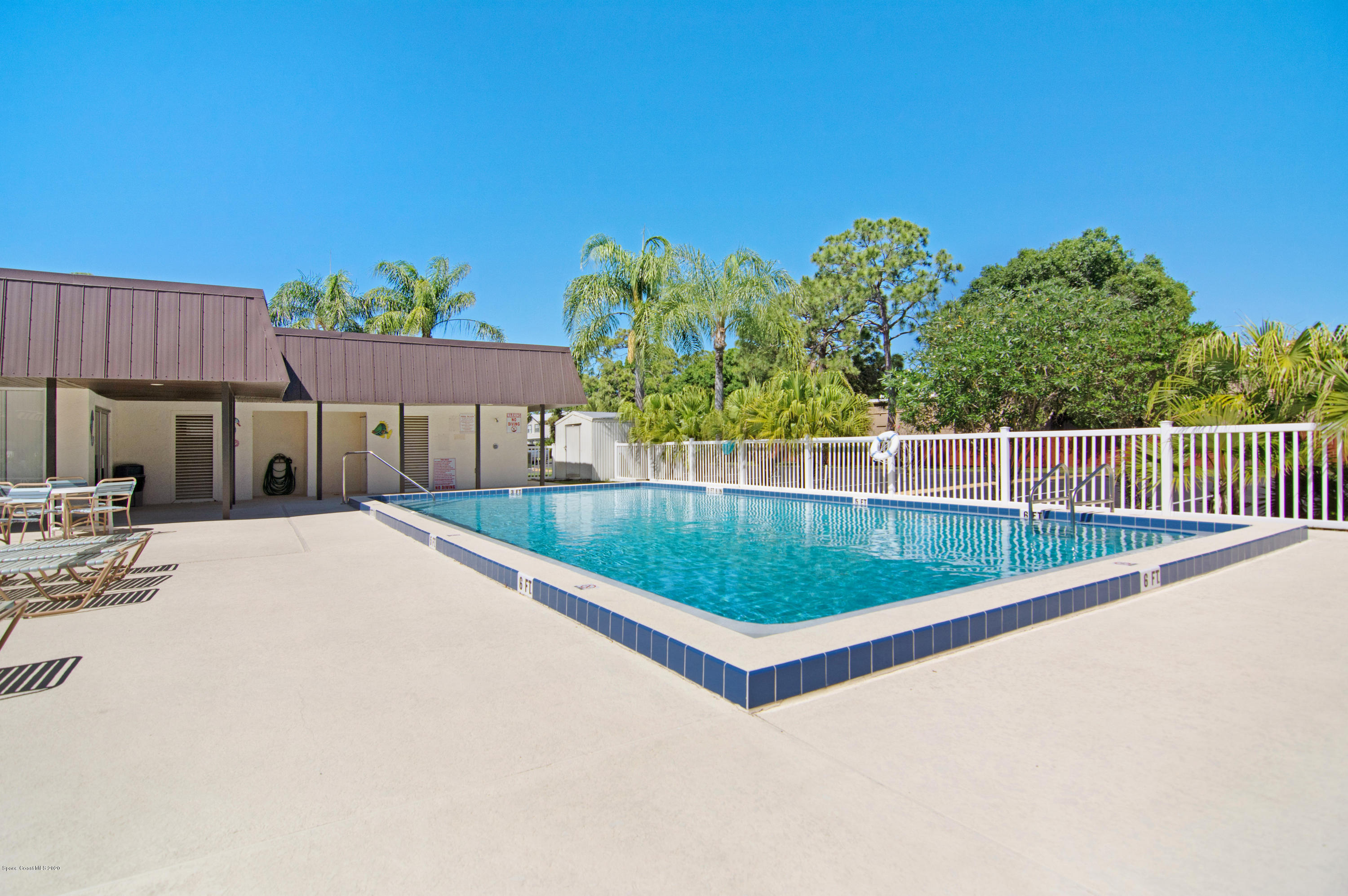 708 Ridge Club Drive, Unit 37 Melbourne, FL 32934 - Photo 18 of 25 a view of a backyard and swimming pool