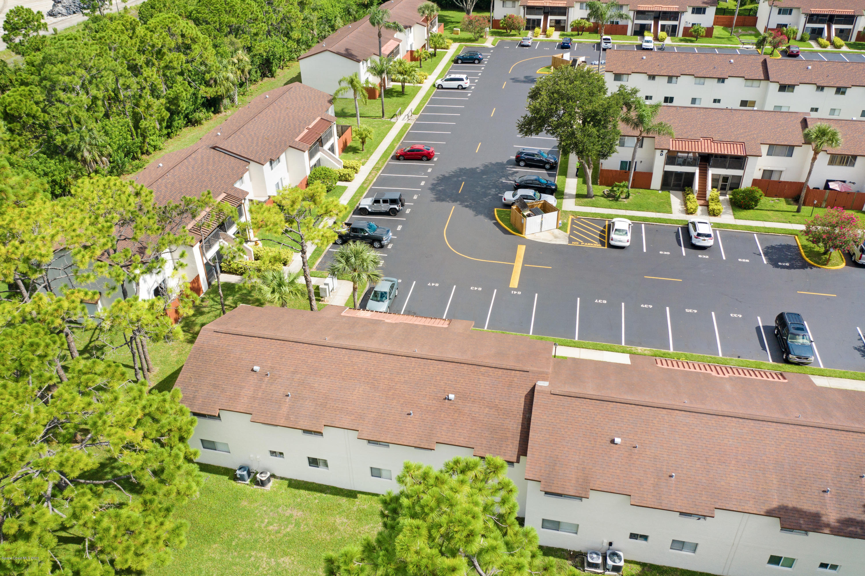 708 Ridge Club Drive, Unit 37 Melbourne, FL 32934 - Photo 24 of 25 an aerial view of a house with a yard and lake view