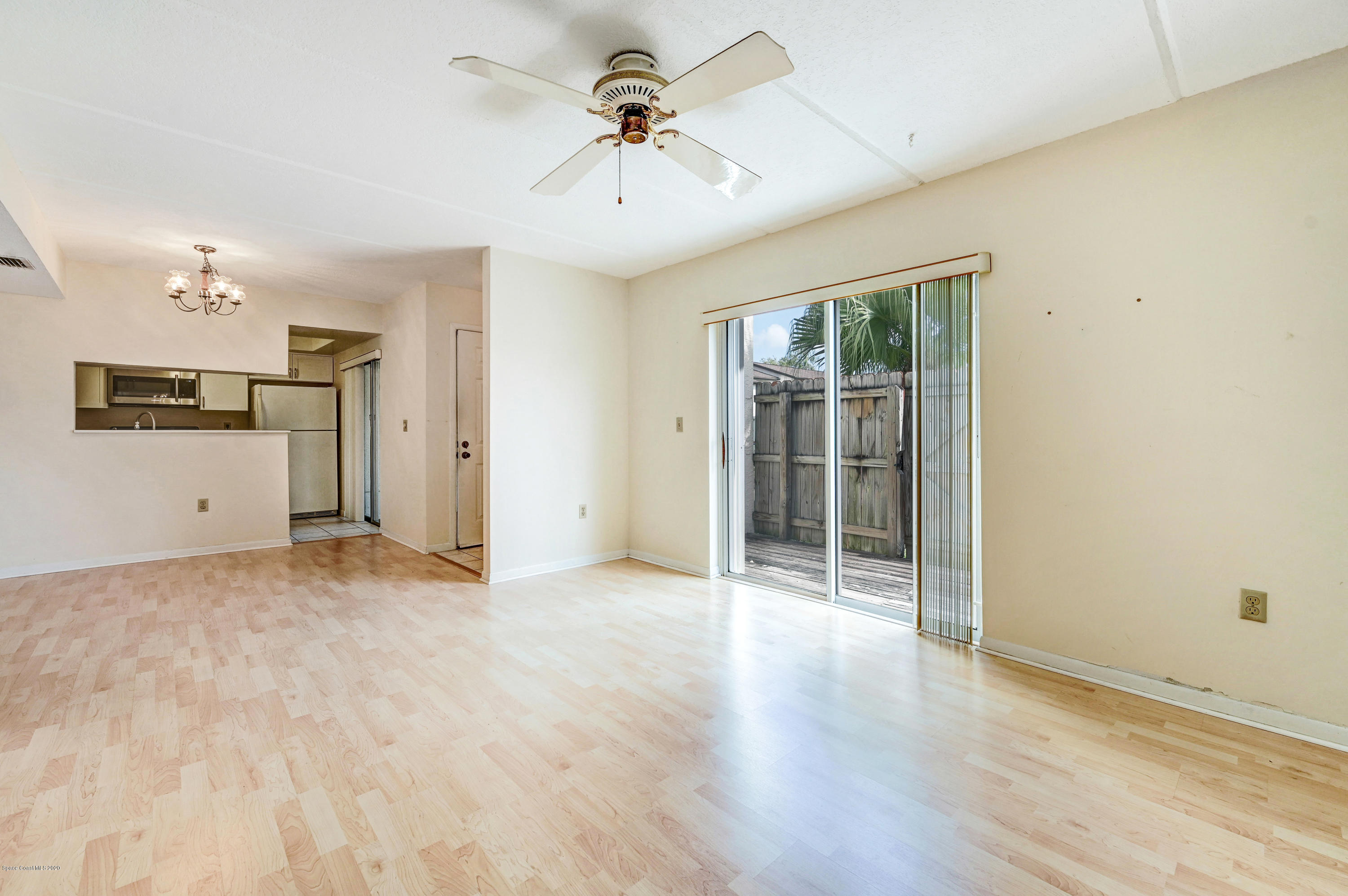 708 Ridge Club Drive, Unit 37 Melbourne, FL 32934 - Photo 5 of 25 wooden floor in an empty room with a window