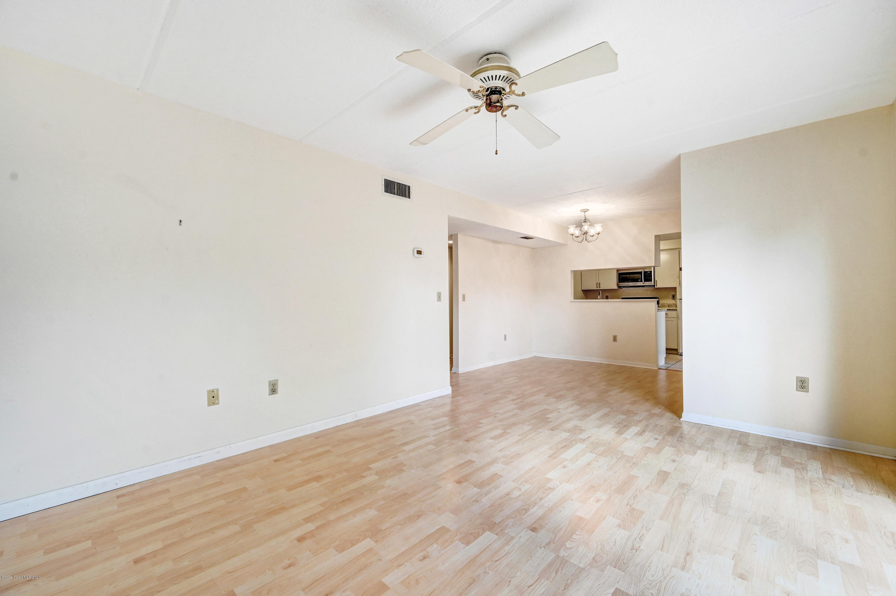708 Ridge Club Drive, Unit 37 Melbourne, FL 32934 - Photo 6 of 25 a view of a kitchen with a sink and a refrigerator