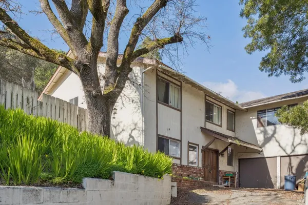 a house with a tree in front of it
